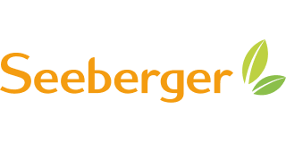 Das Seeberger-Logo zeigt den Firmennamen in orangefarbener Schrift mit zwei grünen Blättern daneben.